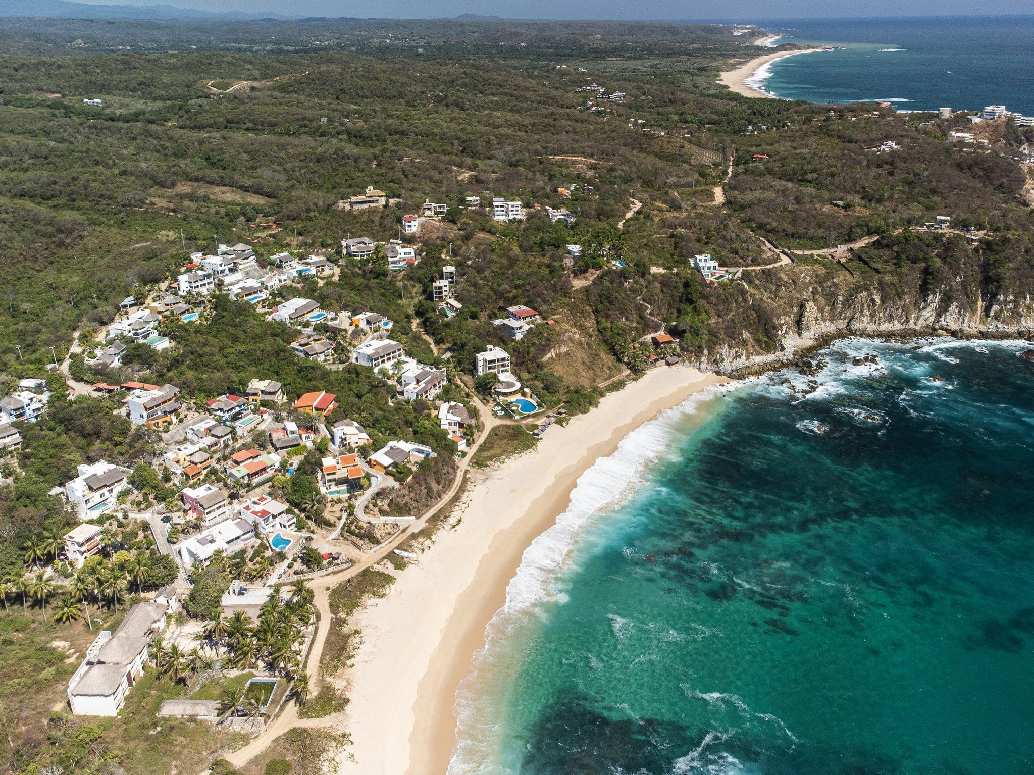 Aerial view of the bay and white sand of Playa Salchi