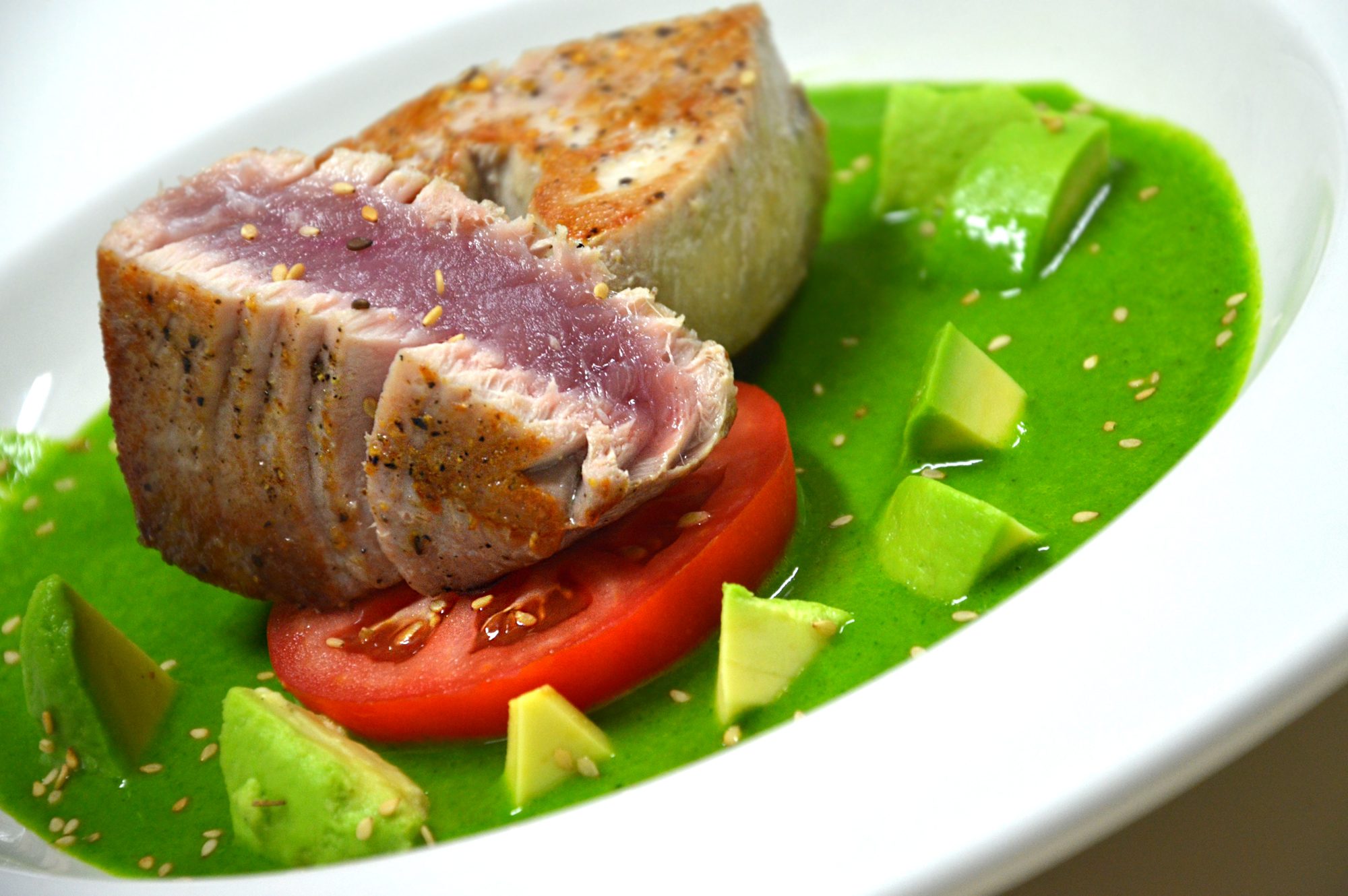 Seared tuna with cilantro sauce, tomato and avocado
