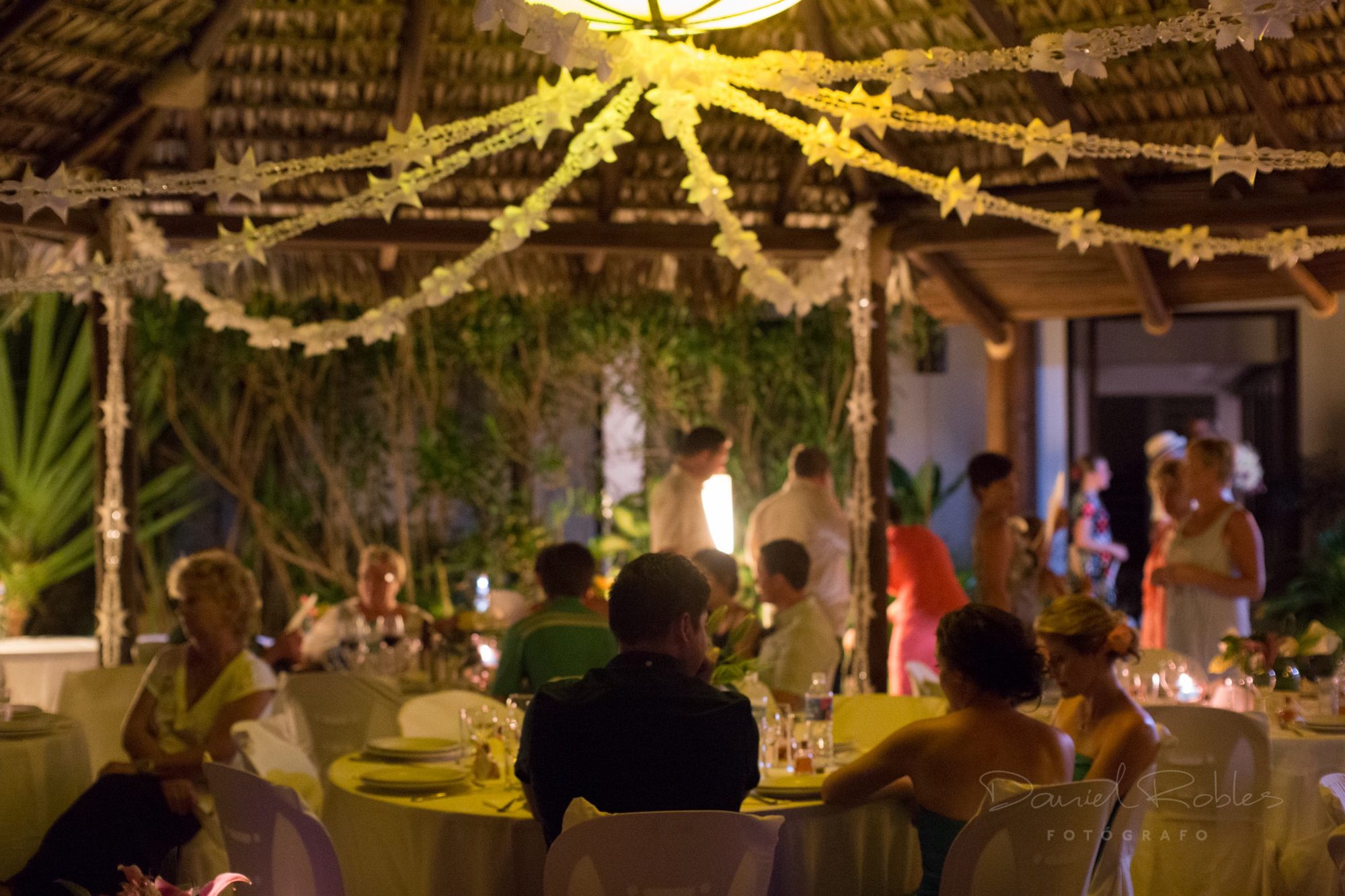 A candlelit wedding dinner under the palapa